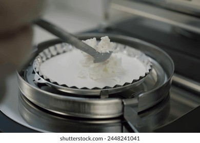 Laboratory scales in assessing the quality of cottage cheese products. Dairy plant. - Powered by Shutterstock