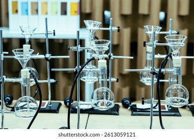 A laboratory setup featuring multiple glass apparatuses for experiments, reflecting a clean and organized scientific environment.