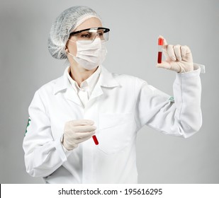 laboratory technician with blood collection vial