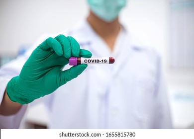 Laboratory Technician Hold On Blood Sample Tube For Corona Virus Test , COVID 19 Test  