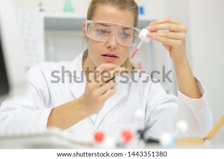laboratory technician with micro pipette