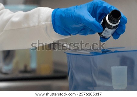 Laboratory technician using a precision scale on pharmaceutical industry