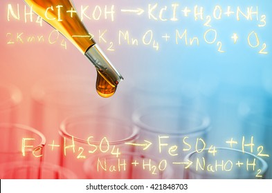 laboratory test tubes with gold chemical equation background