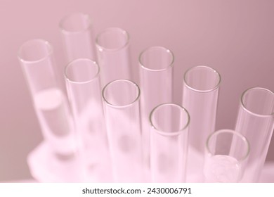 Laboratory test tubes on colored background