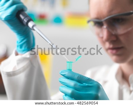 Similar – Image, Stock Photo Laboratory worker pipetting with pipette