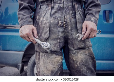 The Laborer, Who Is Wearing A Dirty Overalls And Two Tools In His Hands In Finland. Image Includes A Effect.