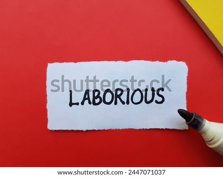 Laborious writting on red background.