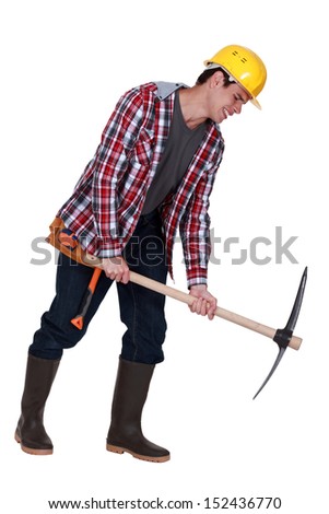 Labourer performing back-breaking work