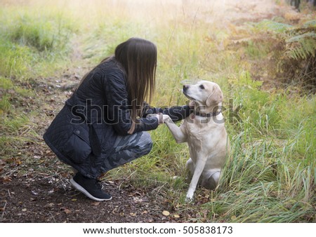 Similar – Image, Stock Photo Loving young woman offered a paw by her dog