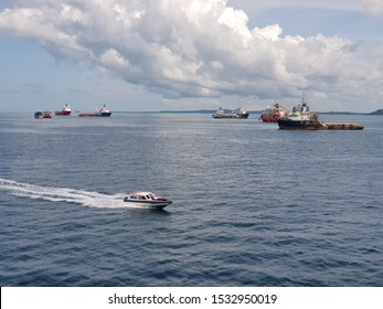 Labuan, Malaysia - December 7, 2018. A speed boat is widely used as a water taxi for personnel going to and from anchored vessel at Labuan outer port limit anchorage