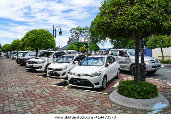 Labuan,Malaysia-May\
3,2016:Carpark in the Labuan street. People in Labuan island have a\
problem not enough parking space due to limited space and too many\
new cars in the Labuan island\
road.\
