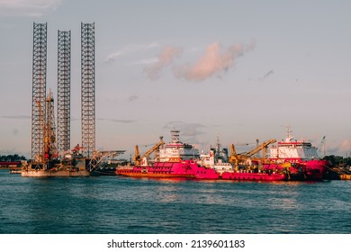 Labuan,Malaysia-May 7,2016:Offshore supply vessels with a jack-up drilling rig in Labuan,Malaysia. The jackup, as it is known informally, is towed onto location with its legs up and the barge section.
