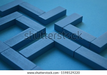 Labyrinth concept. Abstract pattern made blue wooden bricks. Stalemate or deadlock. Labyrinth game. Find exit. Modern art. Labyrinth and making decisions.