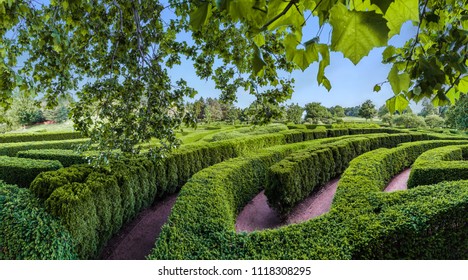 A Labyrinth Hedge Maze Seen From Above With A Blue Sky.