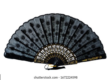 Lace black and gold hand fan isolated on white  background. Spanish or Chinese influence. Flamenco fan.