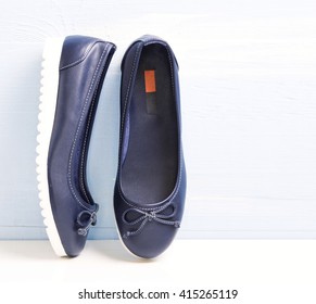 Lace blue leather slippers loafers modern style shoes closeup. Female sport design lady's ballerinas.