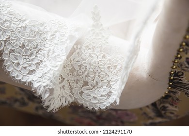 Lace Hem White Wedding Dress On Background Of The Floor