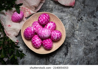 Lace pattern painted pink Easter eggs on a plate on gray background with copy space top view. Easter holiday background - Powered by Shutterstock - Get 15% off with code: PIKWIZARD15