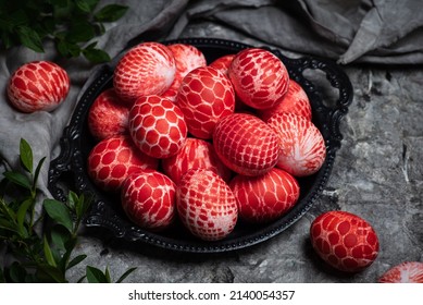 Lace pattern painted red Easter eggs in a bowl with copy space top view. Easter holiday background with colored eggs for religious tradition - Powered by Shutterstock