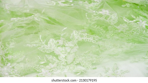 The lace is soft green. Texture. background. template. abstract background with pale green rod, old lace and salad lines. can be used for postcard, poster, texture or wallpaper