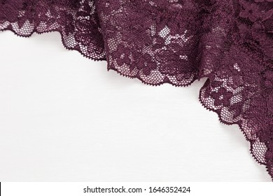 Lace underwear background with dark colored patterned lingerie for women close-up. Romantic Style. Selective focus and copy space.