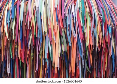 the laces from shoes colored, red, green, yellow, green, a lot of laces hang the beam - Shutterstock ID 1326601640