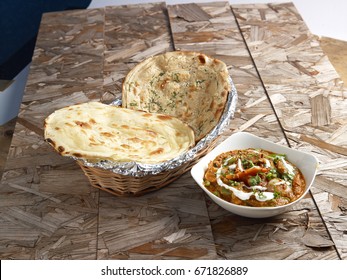 Lachha Paratha Naan With Kadai Vegetable Gravy On Wooden Background