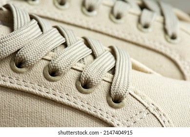 Lacing Of Textile Sneakers Close-up. New Sport Shoe Laced Up, Side View. Elastic Shoes Of Modern Mesh Fabric Trainers For Fitness, Sport Exercises And Active Lifestyle. Sport Fashion. 