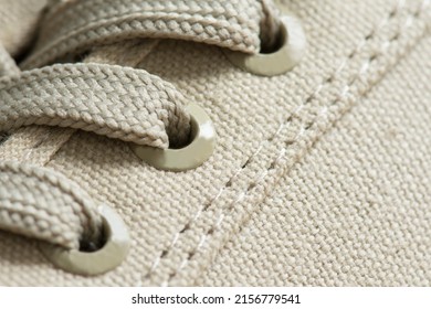 Lacing Of Textile Sneakers Close-up. New Sport Shoe Laced Up, Side View. Elastic Shoes Of Modern Mesh Fabric Trainers For Fitness, Sport Exercises And Active Lifestyle. Sport Fashion.