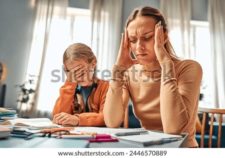 Lack of patience. Irritated woman doing exercises in textbooks with stressed daughter at home. Struggling mom and female child suffering misunderstanding and communication problems by table.