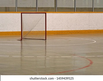 A Lacrosse Net Sitting In An Empty Box.