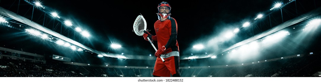 Lacrosse Player, Athlete Sportsman In Red Helmet On Stadium Background With Lights. Sport And Motivation Wallpaper. Wide Banner.