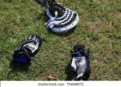 Lacrosse Playing Equipment On The Turf