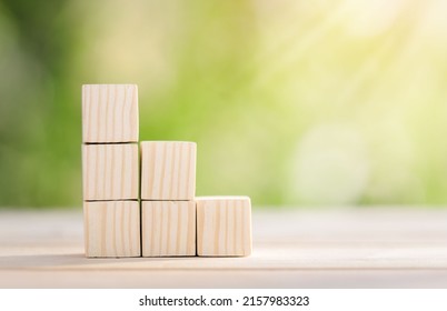 Ladder career path for business growth success process concept. Wooden blocks are stacked in steps that continue to rise. concept for mortgage ladder investment. saving for investment,business growth