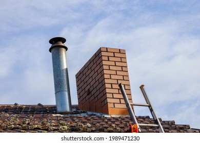 ladder leaning on roof to access chimney
