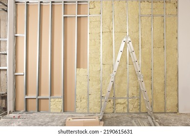 Ladder Near Wall With Metal Studs And Insulation Material Indoors