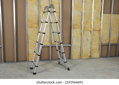 Ladder Near Wall With Metal Studs And Insulation Material Indoors