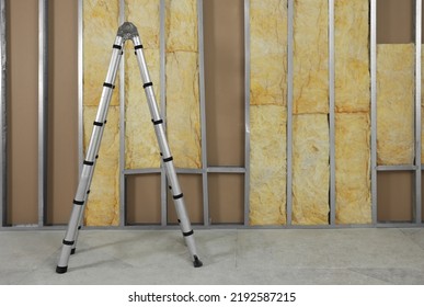 Ladder Near Wall With Metal Studs And Insulation Material Indoors