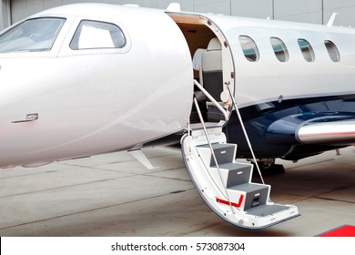 Ladder With Open Door In Business Jet Airplane