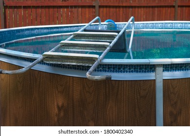 A Ladder Removed From An Above Ground Pool Seemingly Closed For Disinfection