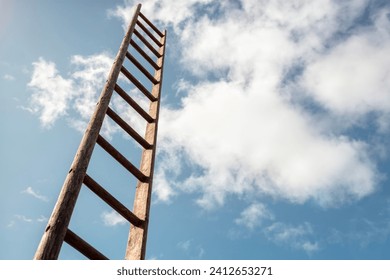 Ladder of success looking up into blue sky with white cloudscape background business career and promotion concept