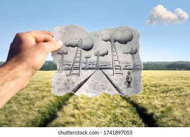Ladders leading to the sky drawn on a hand held piece of paper with green field and sky in the photo background. Mixed media image.