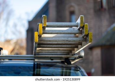 Ladders On The Roof Rack Of A Builders Van