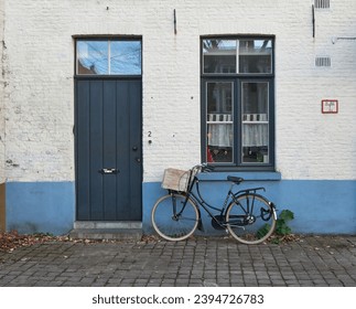 Ladies dutch bike parked in front of cozy house - Powered by Shutterstock