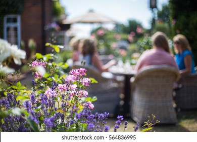 Ladies Enjoying A Drink In Pub Garden People Blurred