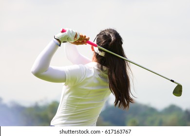 Ladies Golfer Finished Golf Swing.