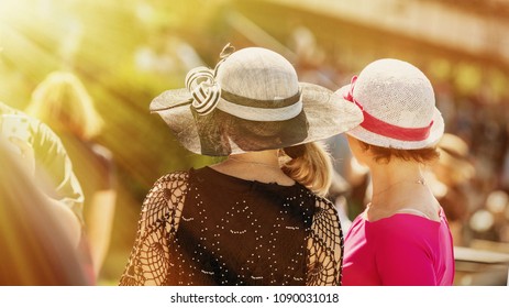 Ladies With Hats On The Race Track. Romantic Summer Hats. Retro Style Summer Romance In Sunny Day.