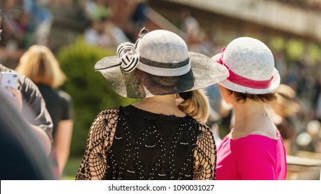 Ladies With Hats On The Race Track. Romantic Summer Hats. Retro Style Summer Romance In Sunny Day.