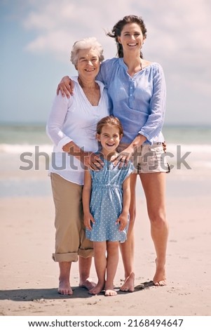 Similar – Little girl running with women on beach