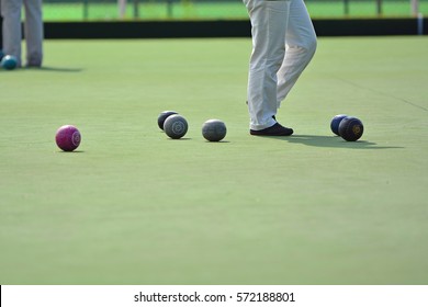 Ladies Playing Lawn Bowls. Soft Focus On The Blurred Background.